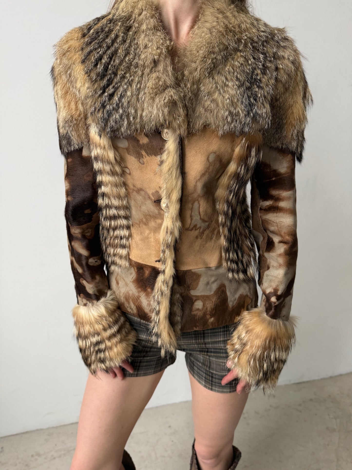 Vintage leather and natural fur patchwork jacket with sculptural silhouette