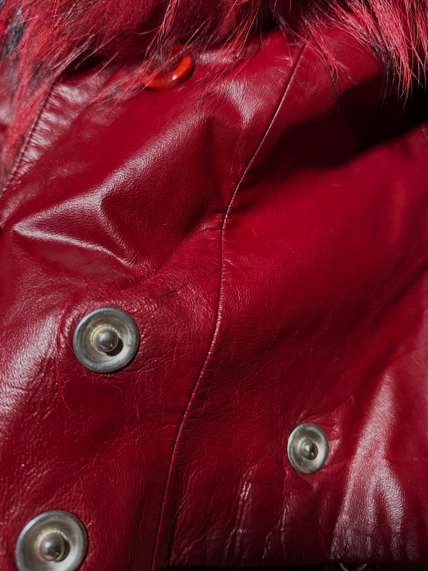 Vintage red leather jacket with luxurious natural fur details