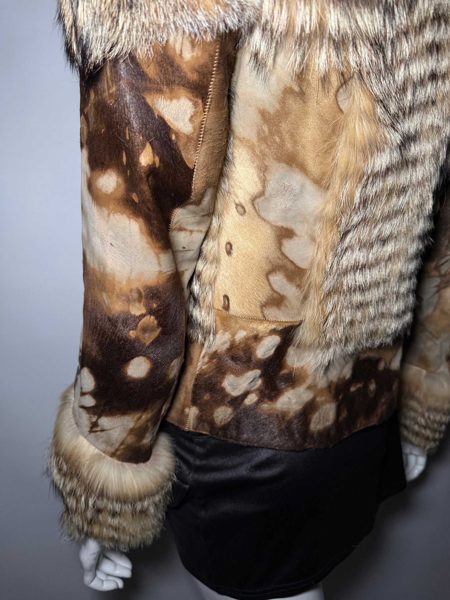Vintage leather and natural fur patchwork jacket with sculptural silhouette