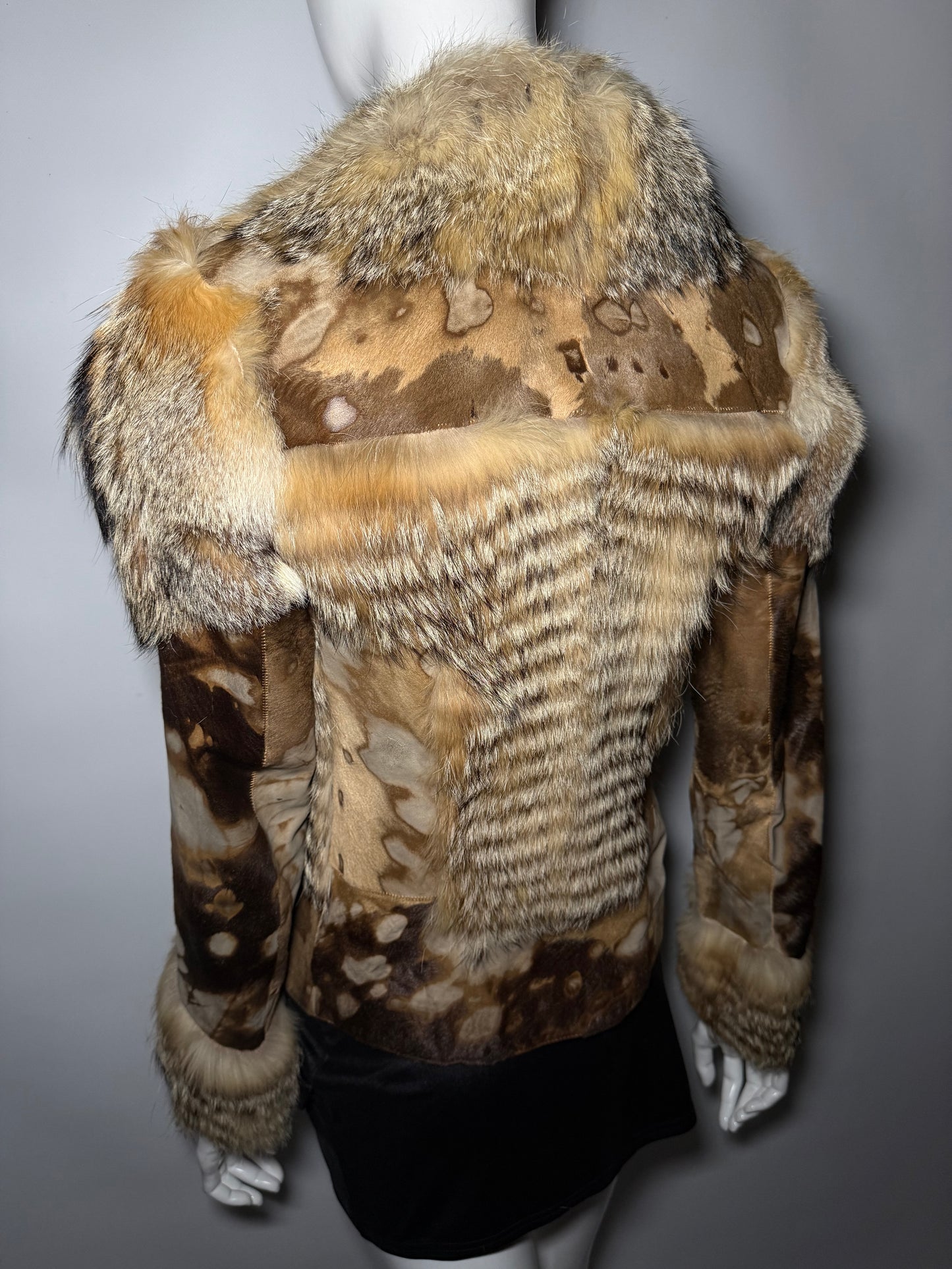 Vintage leather and natural fur patchwork jacket with sculptural silhouette