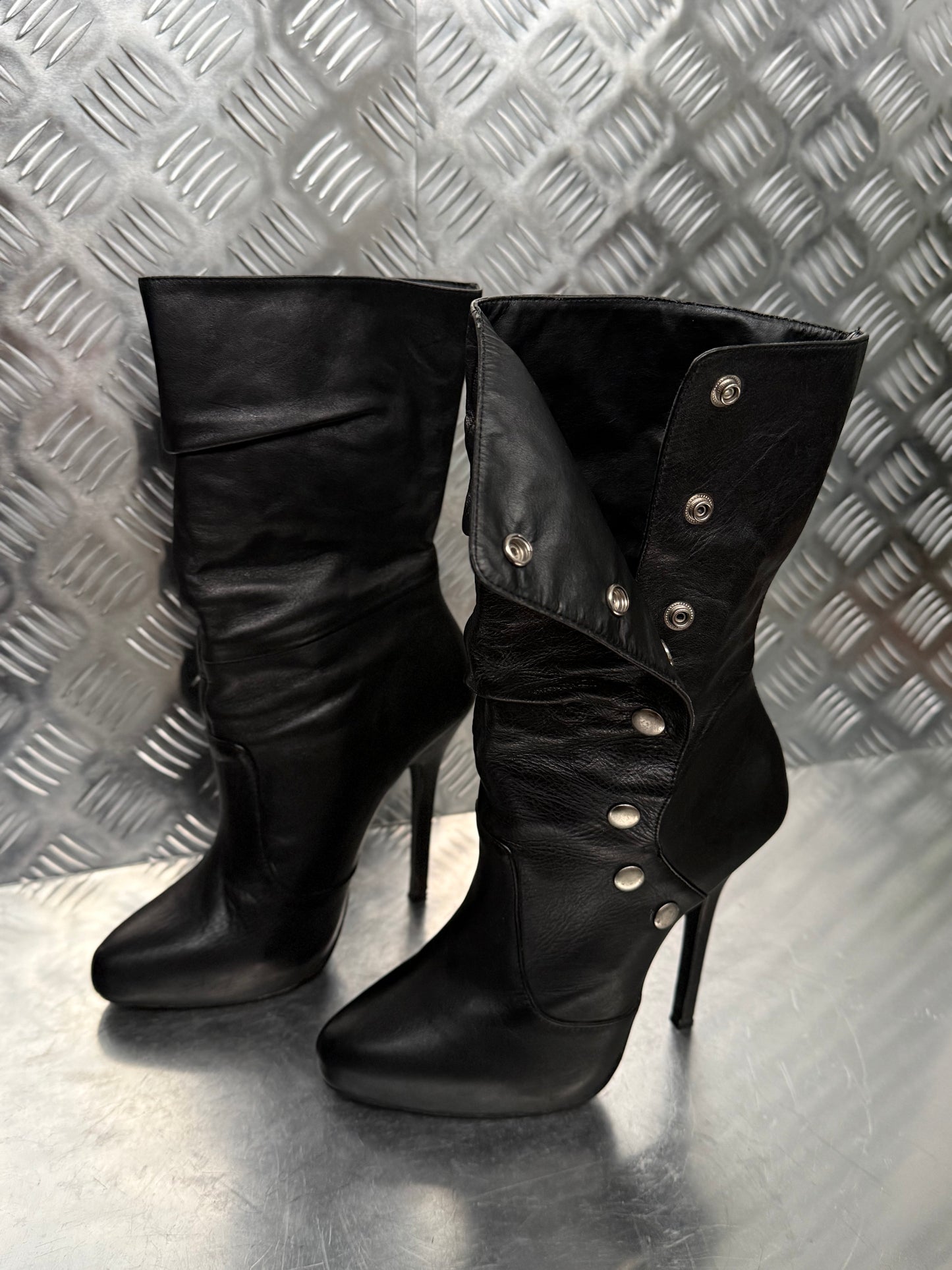 Vintage black leather heeled boots with metal button detail
