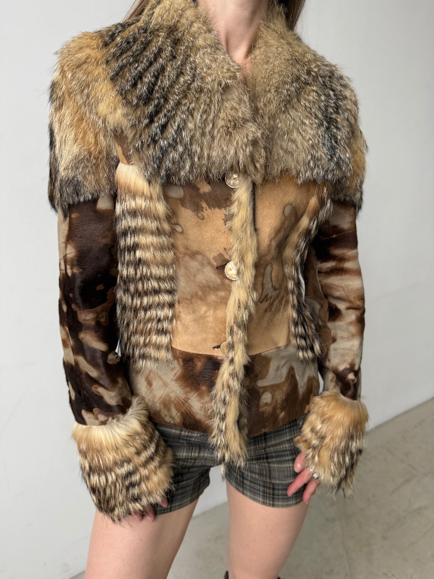 Vintage leather and natural fur patchwork jacket with sculptural silhouette