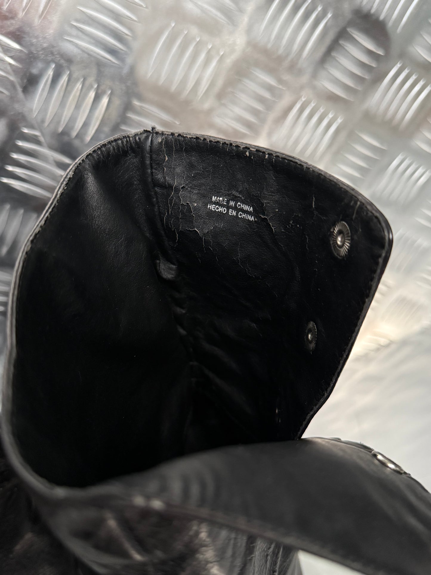 Vintage black leather heeled boots with metal button detail