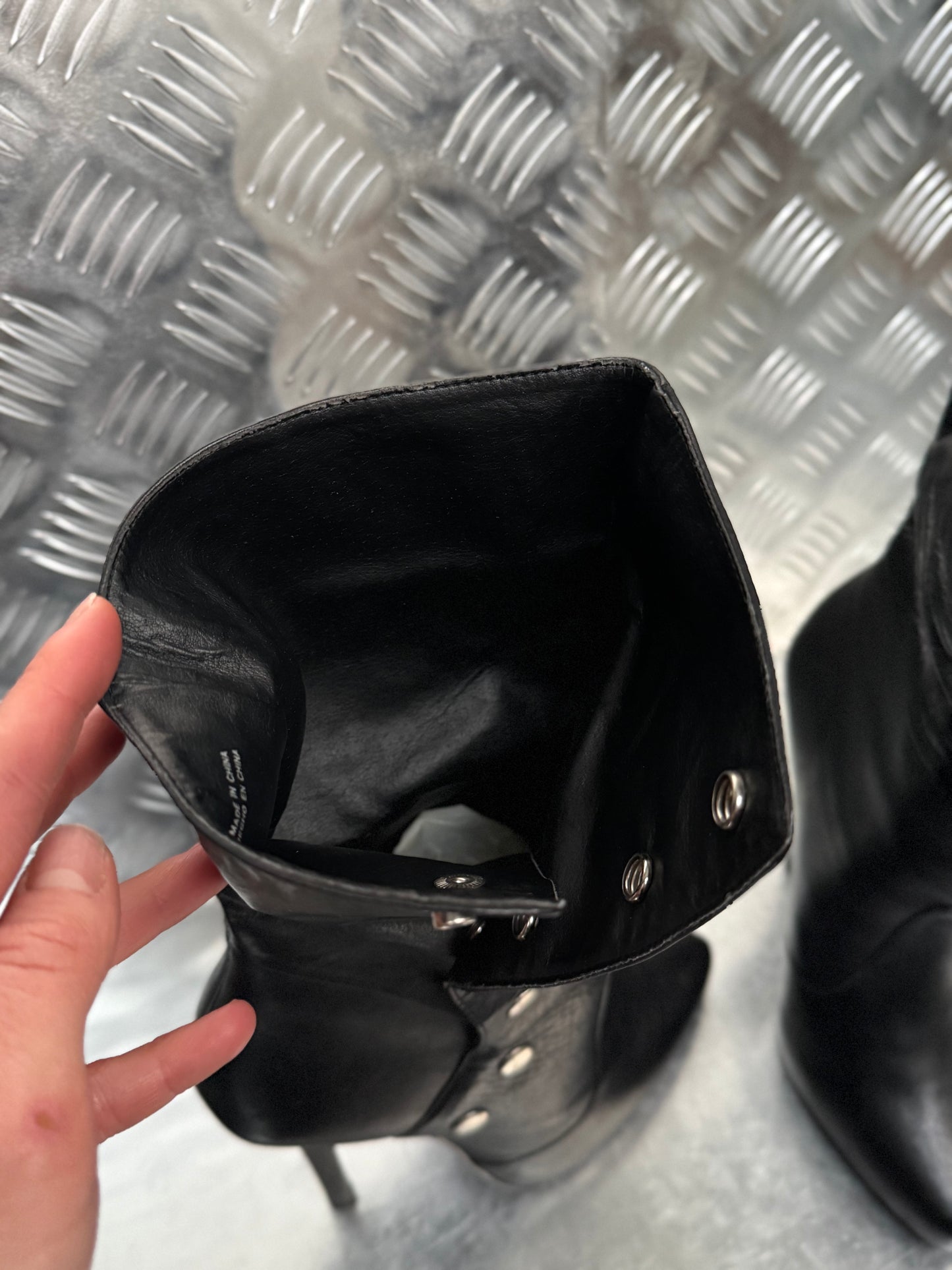 Vintage black leather heeled boots with metal button detail