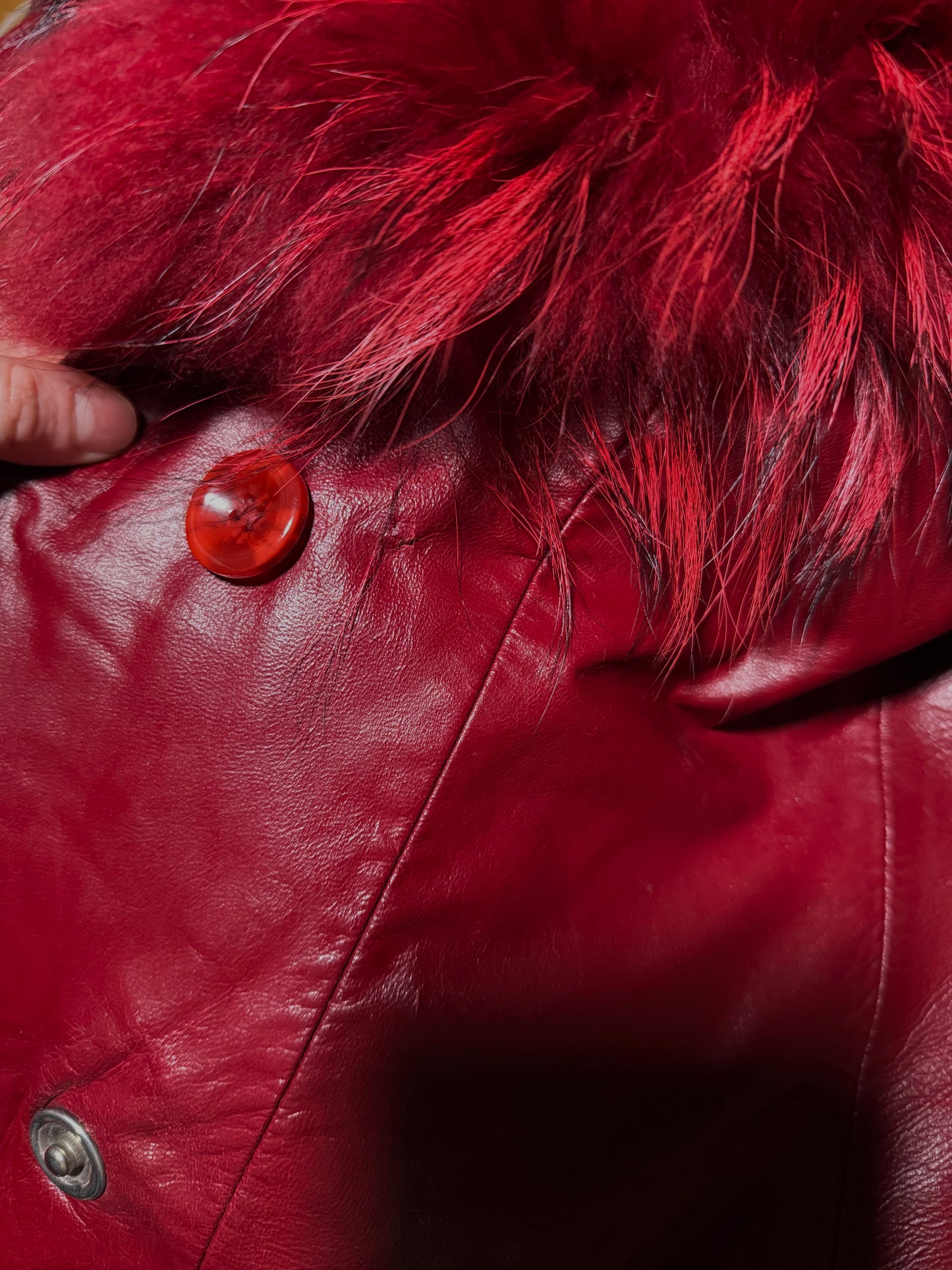 Vintage red leather jacket with luxurious natural fur details