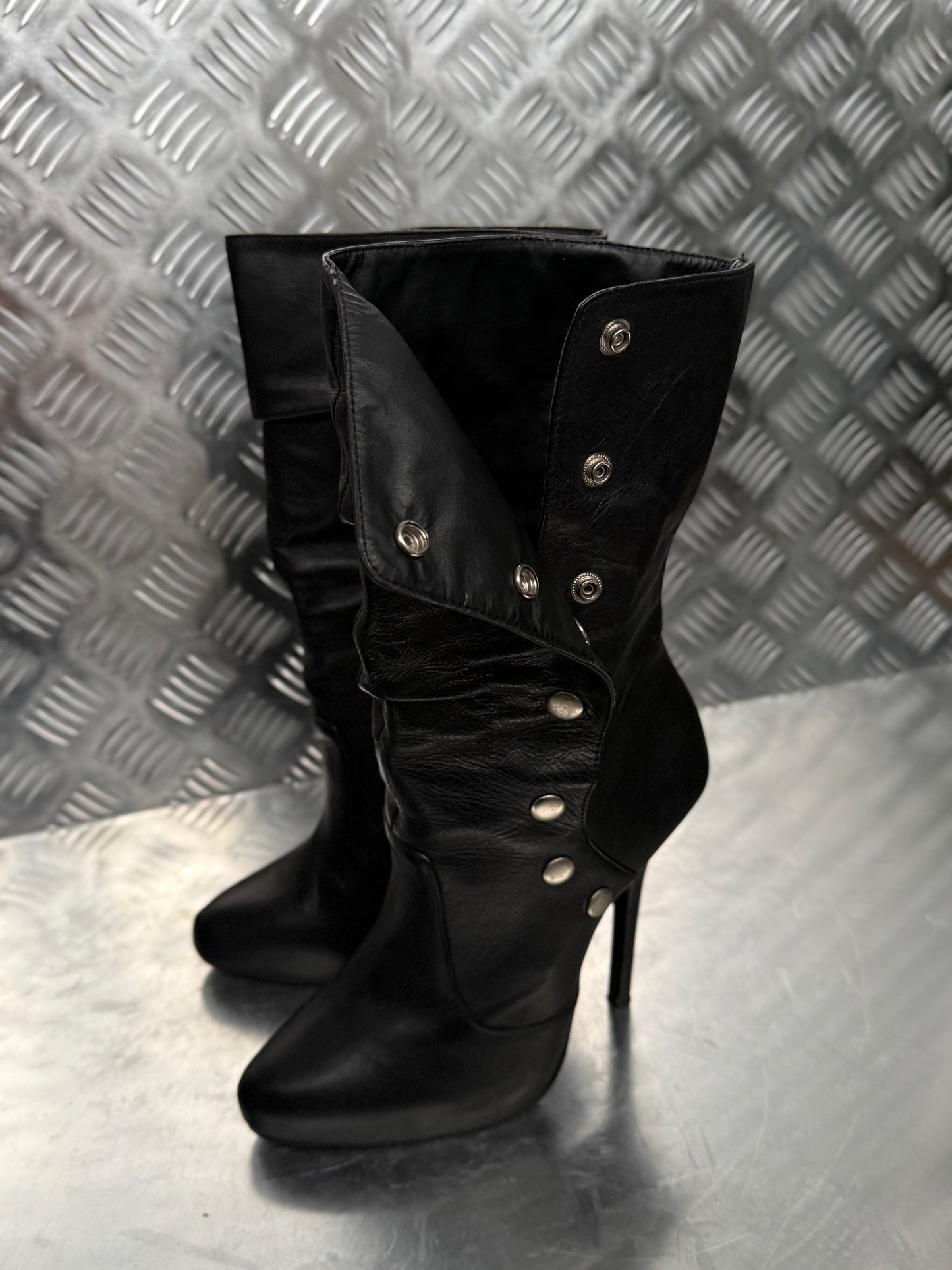 Vintage black leather heeled boots with metal button detail