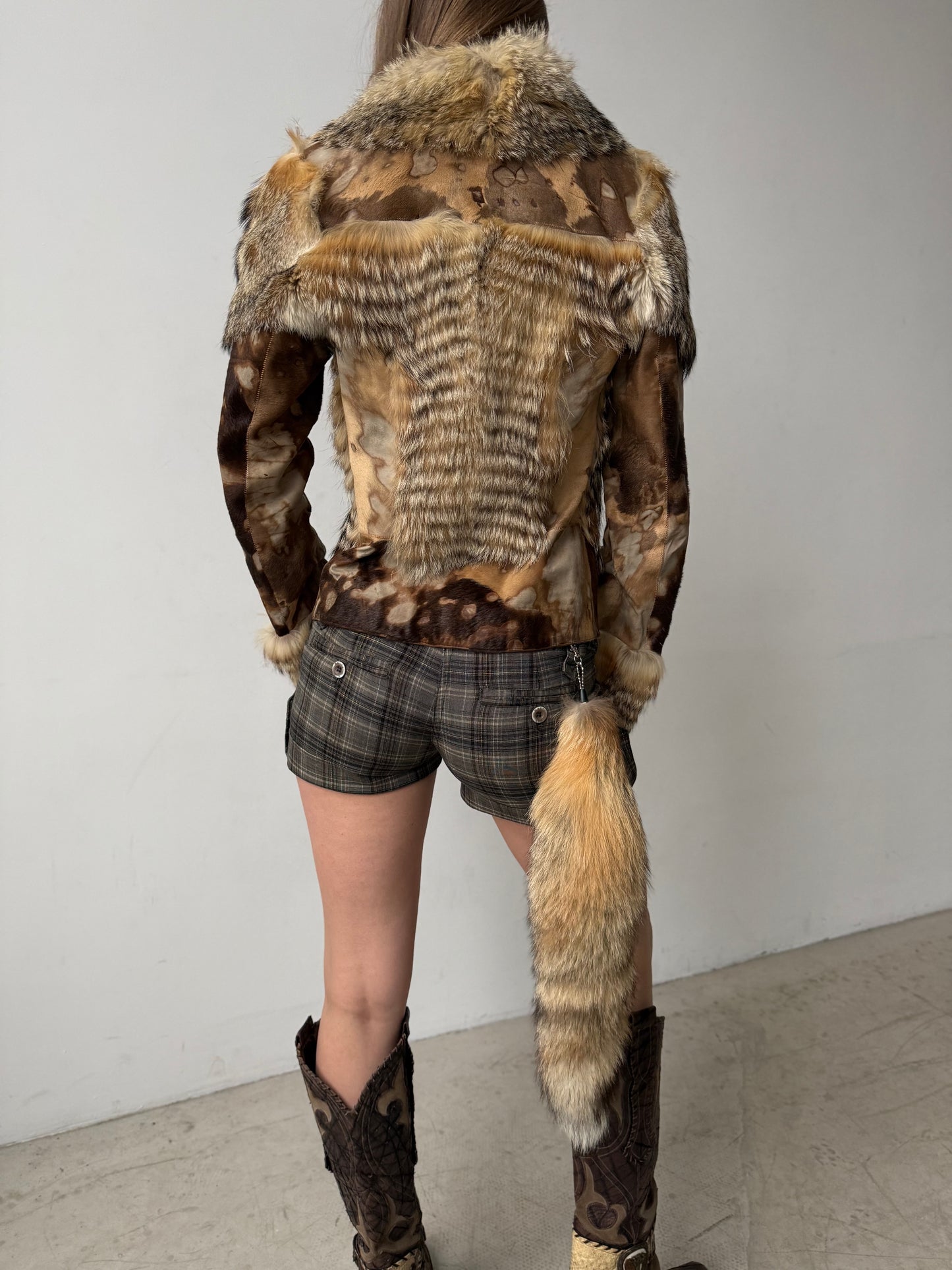 Vintage leather and natural fur patchwork jacket with sculptural silhouette