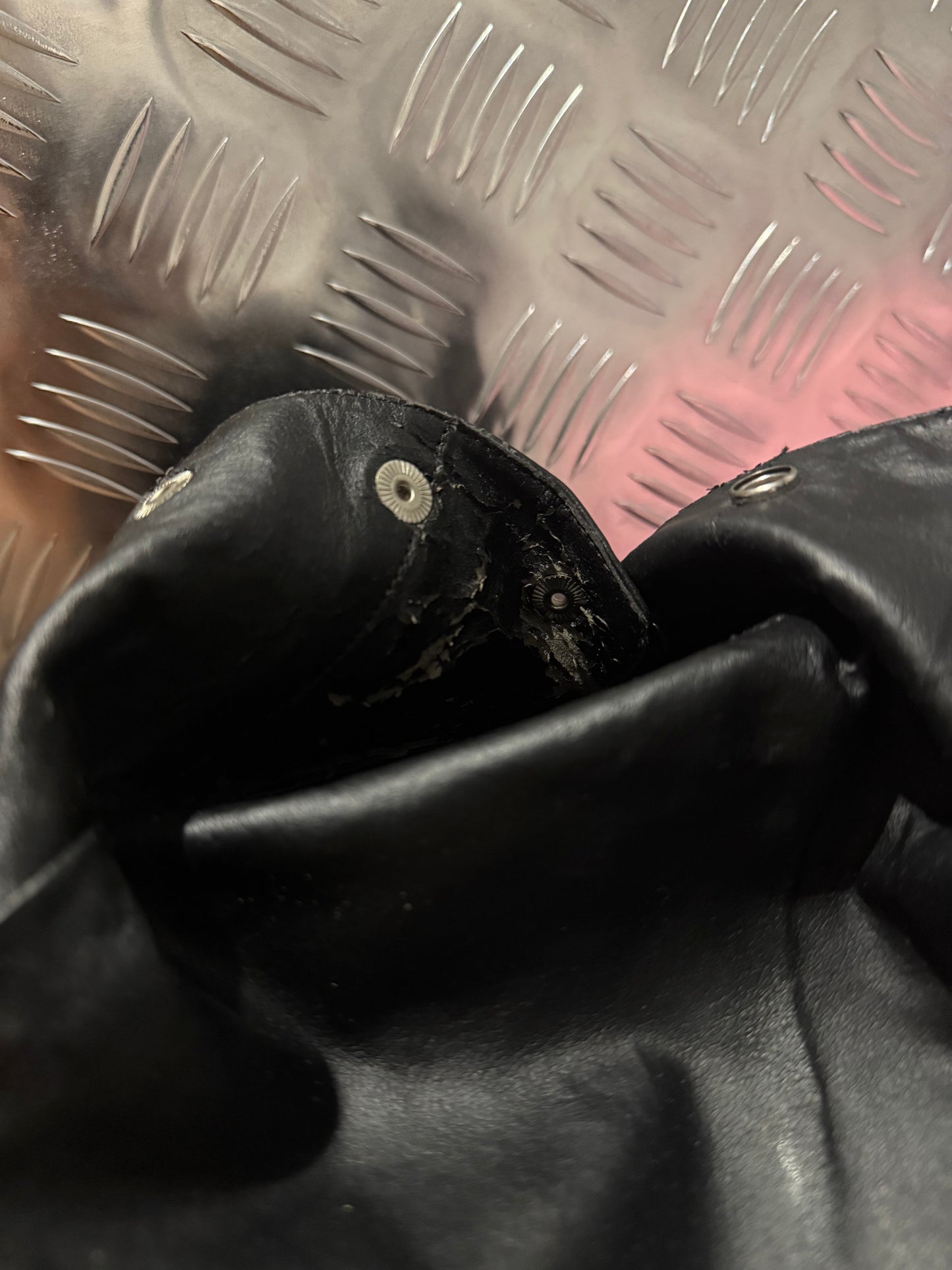 Vintage black leather heeled boots with metal button detail